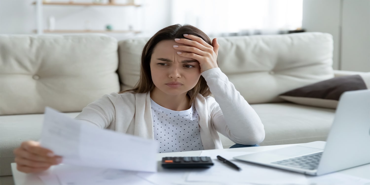 Woman looking at foreclosure notice - house selling options